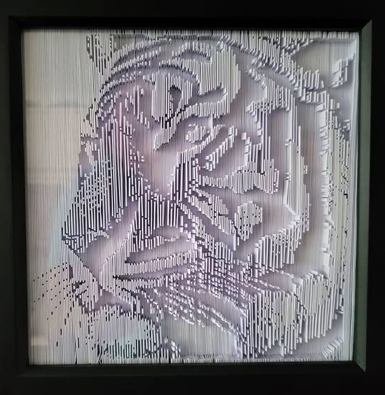Completed framed folded paper pattern of a tiger created using Framesmart pattern maker