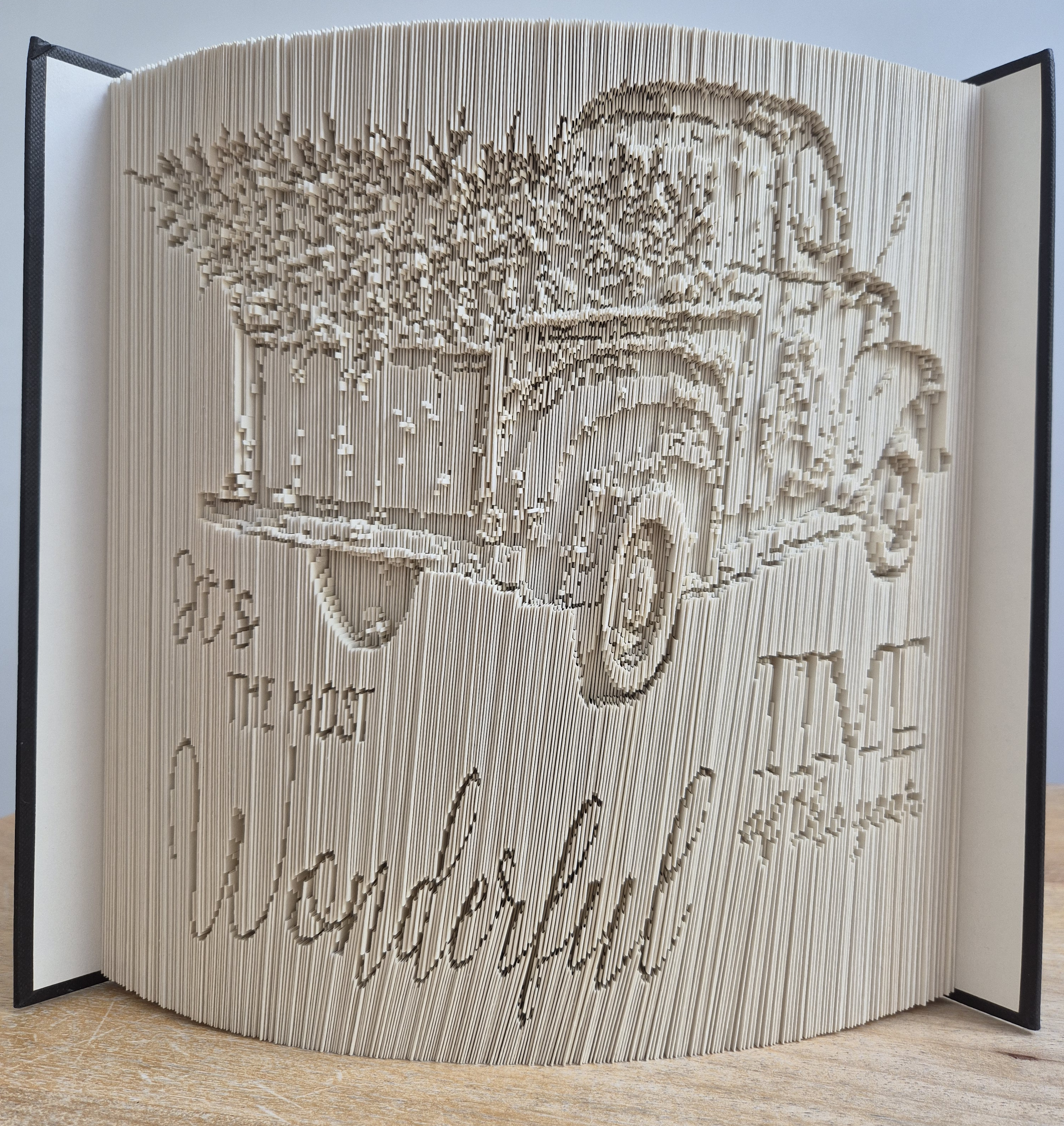Completed multi-layer folded book with a truck, Christmas tree, and text "It's the most wonderful time of the year" created using Framesmart